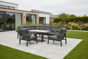 Outdoor furniture set with gray sectional sofa and chairs around a beige table on a white background